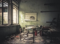 Abandoned class room with school books still on the desk