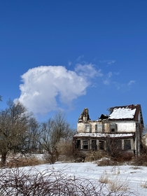 Abandoned farmhouse in Spring City PA Featuring a cloud from Limericks nuclear reactors in the background