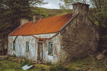 Abandoned hidden cottage on a hill Kerry Ireland