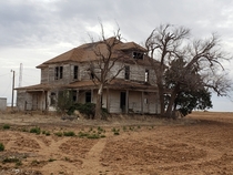 Abandoned house on a hill surrounded by farm land Plainview TX