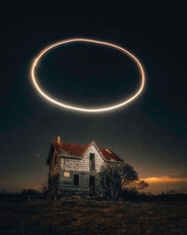 Abandoned house with halo ring above it