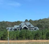 Abandoned mid construction mansion slowly getting swallowed by trees Barnesville Ga