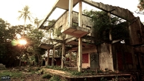 Abandoned modernist French villa in Cambodia being digested by nature 