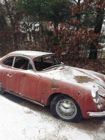 Abandoned old Porsche that is beaten to hell 