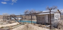 Abandoned outdoor pool in Warm Springs Nevada The pool is fed from a natural warm spring further up the hill this is at the base of 