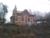 Abandoned s station building Pokrovskoye-Streshnevo Moscow Russia photo is taken from a trains window passing