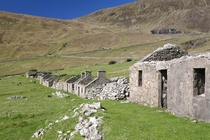 Abandoned Scottish island of St Kilda - A row of abandoned cottages on the island - It is now a tourist destination in Summer