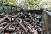 Abandoned scrap yard full of old war equipment