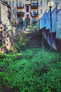 Abandoned staircase to a soccer field Italy