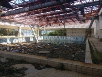 Abandoned swimming pool in former Serbian military hotel outside Dubrovnik