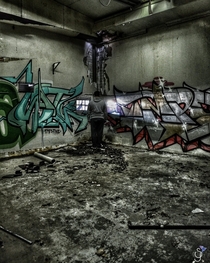 Abandoned trashed factory covered in graffiti