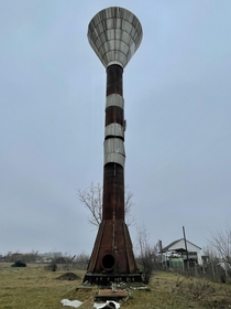 Abandoned water tower at a pig farm on a hungarian countryside