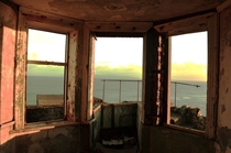 Abandoned World War lookout facing the sea during a stormy sunrise Torr Head Northern Ireland 