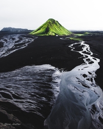 Across vast black sands and an intricate web of rivers formed by glacial melt-off there lies a lonely and improbable green hill In fact its a volcano This ladies and gentlemen is Mlifell Southern Highlands Iceland  Instagram joe_shutter
