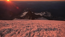 After climbing to  ft on Mt Rainier in the dark we stopped to take in the sunrise alpenglow 