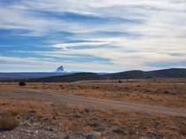 After days in the desert I stumble upon this monstrosity it is still  miles away here Shiprock Utah 