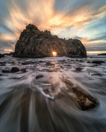 After three years of trying I finally captured the sun shining through keyhole arch at Pfeiffer Beach in Big Sur CA near the winter solstice  IG ArwinL