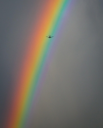 Airplane Flies Through Rainbow NYC