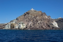 Akrotiri Lighthouse from the Mediterranean in Santorini Greece 