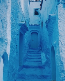 Alley in the city of Chefchaouen Morocco The city is located at the foot of Rif mountain range and is entirely painted in blue Chefchaouen is also known as the blue pearl