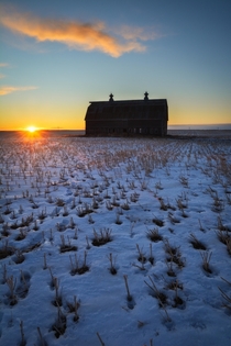 An abandoned barn found in the middle of the prairies C