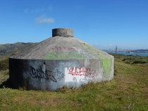 An abandoned military bunker overlooking San Francisco and the Golden Gate Bridge  Its very green here right now after all the rains