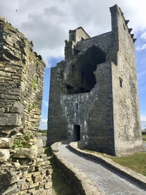 An abandoned tower castle damaged by cannonball blast Near the Shannon River Ireland  OC