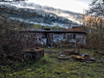 An abandoned trailer at the foot of the mountains Vancouver Island