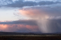 An afternoon monsoon catches the final rays of sunset near Flagstaff AZ 