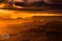 An amazing moment as rain and hail are illuminated by the sun as it sets on the Grand Canyon 