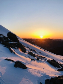 An early spring sunrise illuminating the snows on Mount Lafayette in New Hampshire 