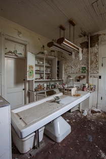 An embalming room inside an abandoned funeral home OCx