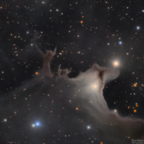 An ghostly figure stands over two light years tall in the dust of our Milky Way As a Halloween treat I created this portrait with over  hours of exposure through an amateur telescope 