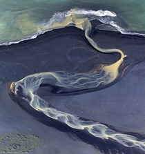An Icelandic river reaching the ocean 