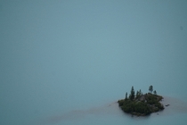 An island in a glacier fed lake British Columbia 