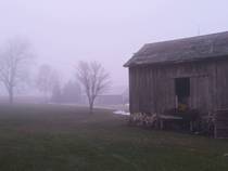 An old barn in the fog in Wisonsin
