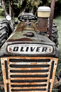 An old Oliver tractor rusting away at an abandoned dairy farm NE of Toronto in Pickering