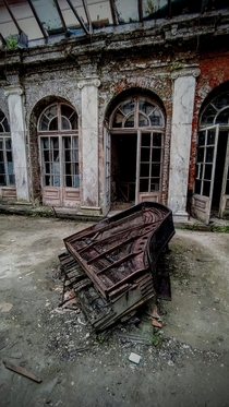 An old piano in abandoned palace near d Poland