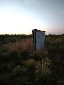An outhouse hours from civilization in West Texas