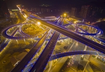 An overpass lighted in blue is seen during a hazy day in Jinan Shandong province China 