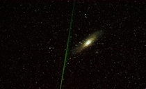Andromeda galaxy and a bright meteor