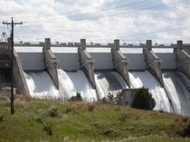 Angostura Dam with its spillway gates open 