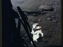 Astronaut Alan Shepard during Apollo  EVA on the moon through the window of the Lunar Module 