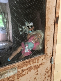 Barbie greeting you as you enter one of the buildings of an abandoned state hospital complex