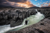 Basalt columns surrounding a river in the Hsafell area Iceland  photo Stian Klo