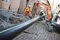 Beer pipeline being installed Bruges Belgium 