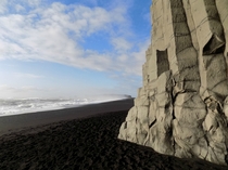 Black sand basalt columns and the Atlantic Ocean at Reynisfjara beach Iceland 