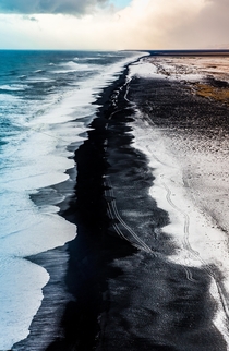 Black Sand Beach after snowfall Iceland 