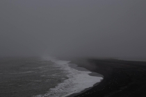 Black sand beach on a foggy morning Iceland 