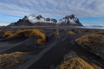 Black sand dunes in front of the dramatic Vesturhorn mountain in southeast Iceland 